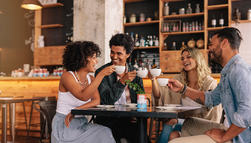 Friends enjoying each other's company—and coffee—at a local shop